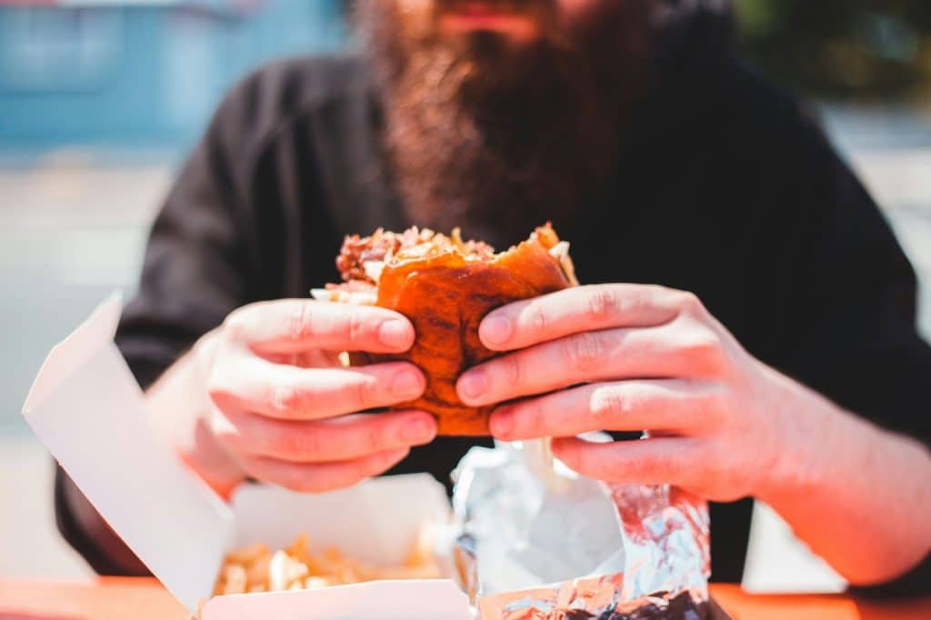 A man holding a food.