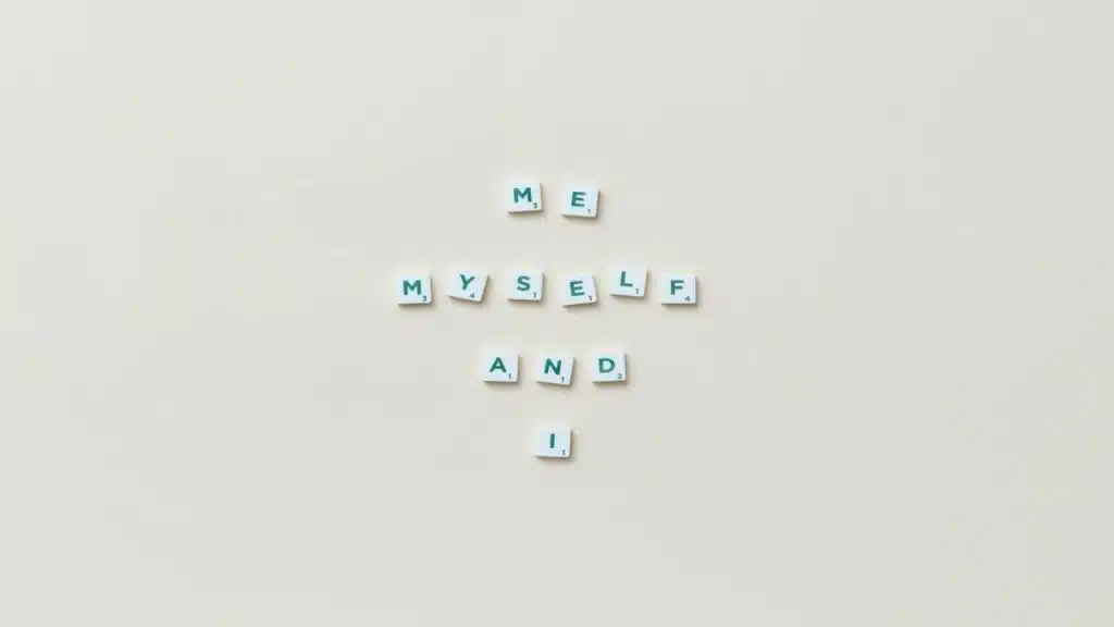 Scrabble tiles spelling out “me, myself, and I”