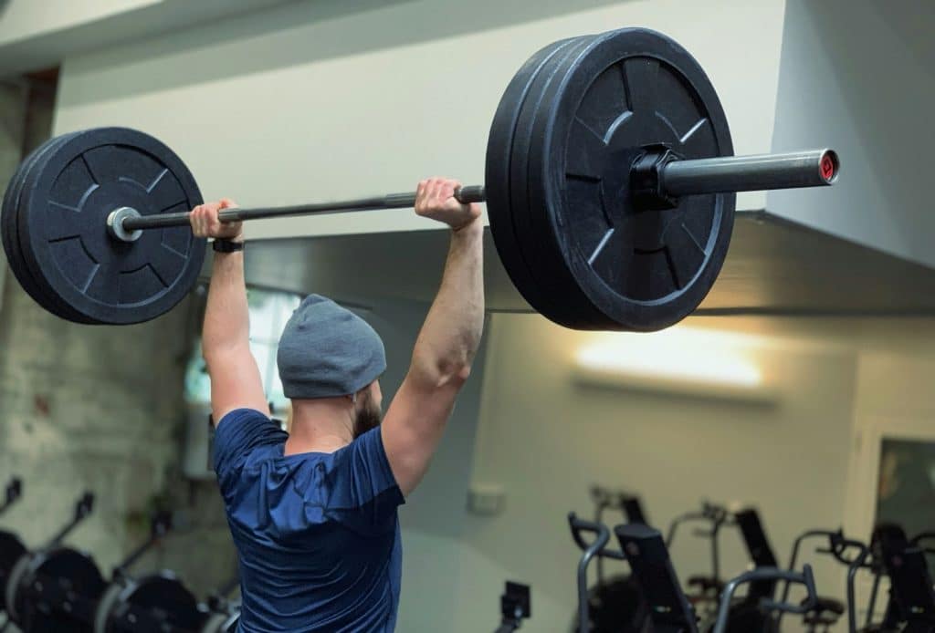 A man lifting a barbell.
