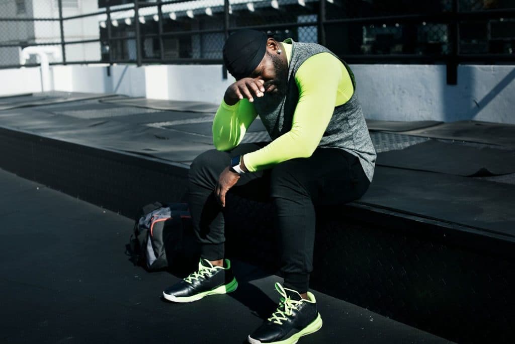 A man resting after a hard workout.
