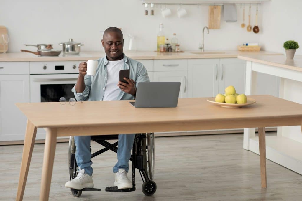 A man using his gadgets happily.