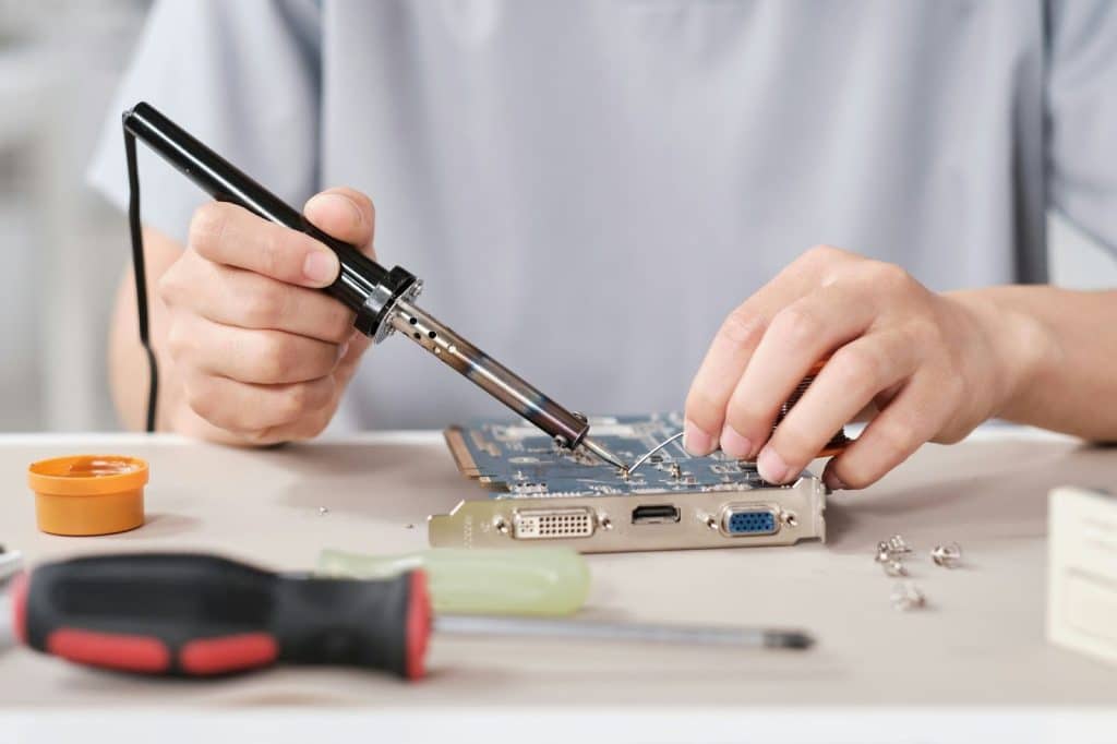 A man repairing something.
