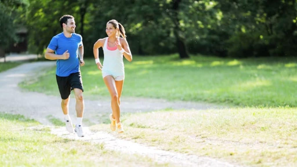 Couple doing an early morning run as part of their fitness routine.