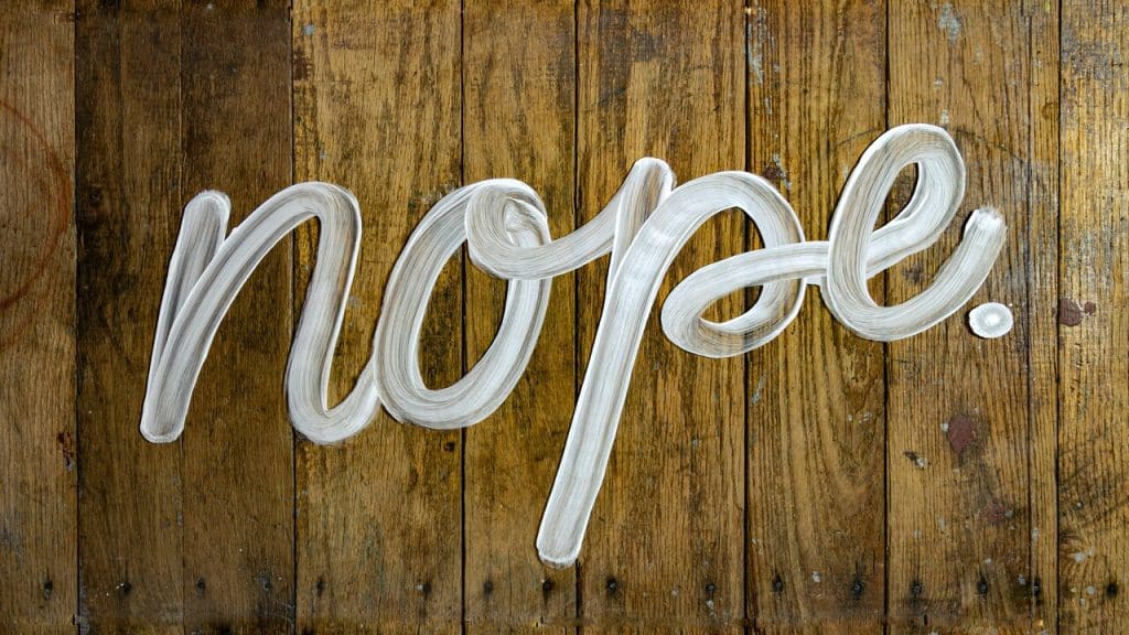 White paint spelling out “nope”