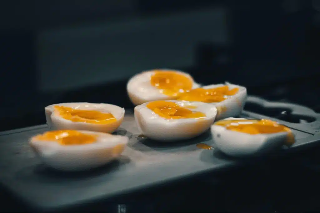 A picture of sliced hard boiled eggs.
