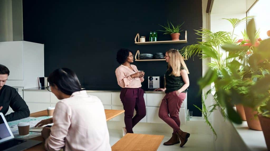 Colleagues talking in the break room