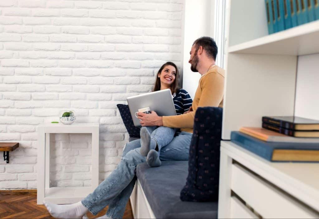 A man letting a woman to have her time while just sitting beside her
