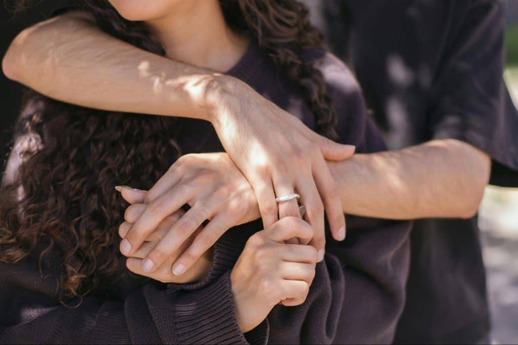 A man embracing a woman