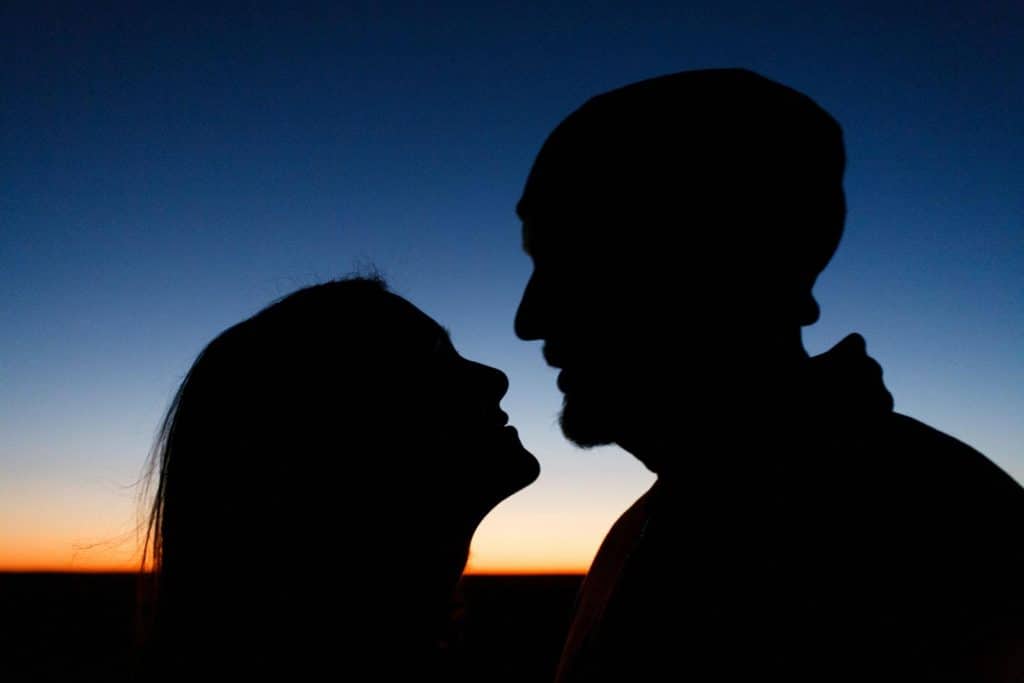 A man and woman at the mountains.