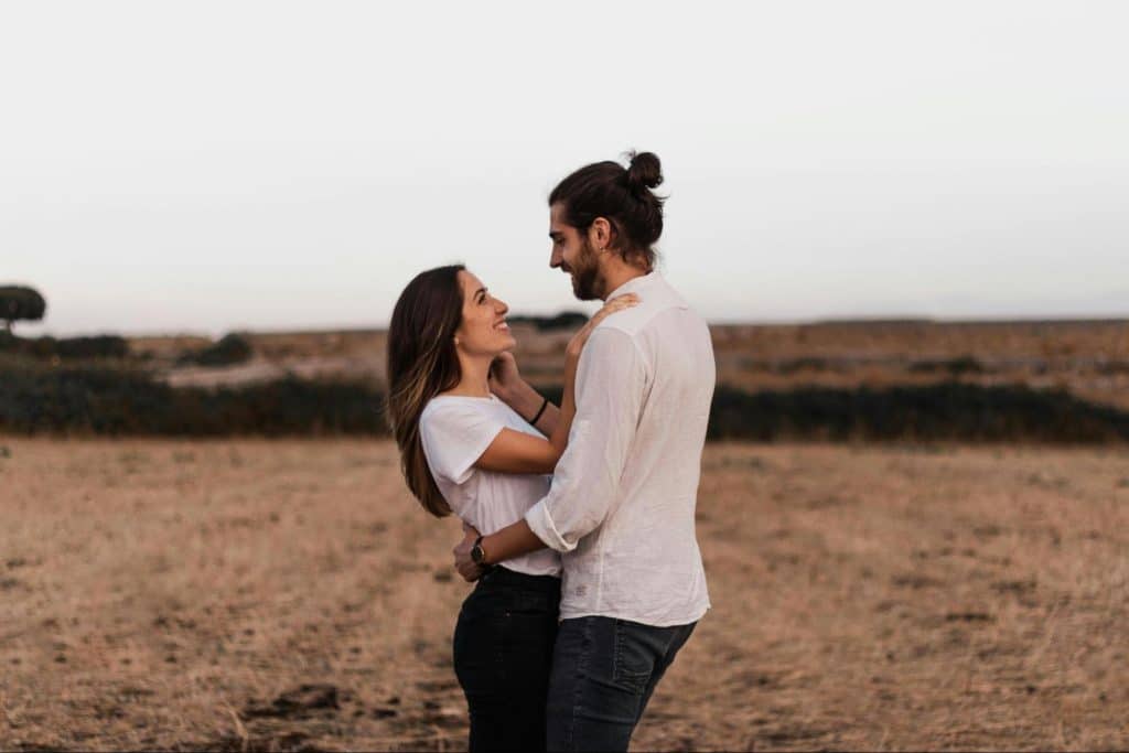A man and woman looking at each other.