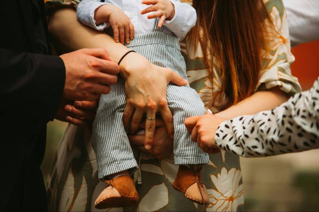 Parents holding a baby 
