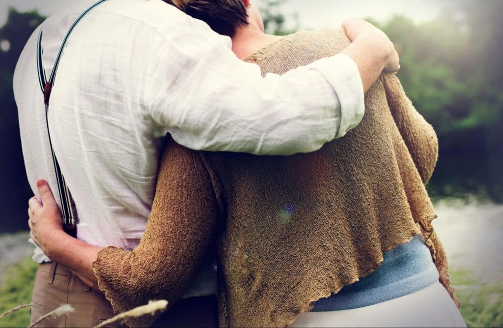 A man comforting a woman