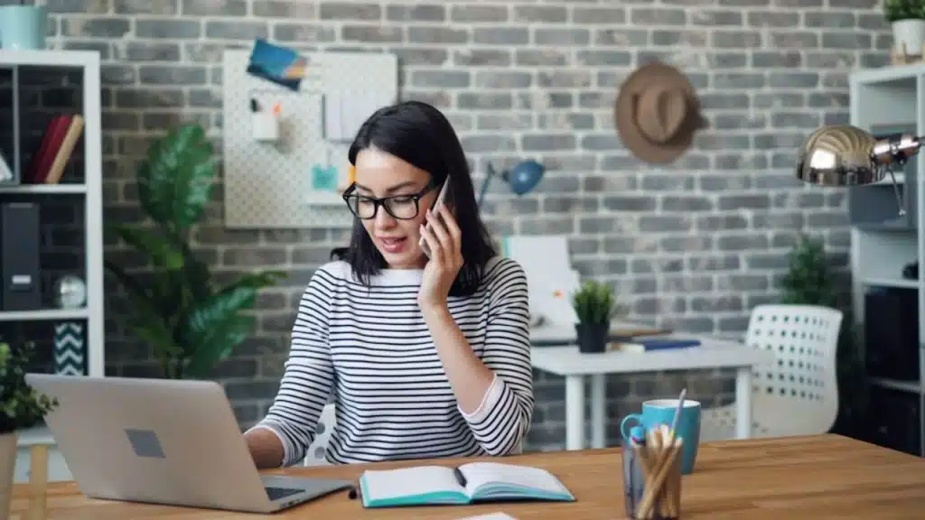 Woman focused on work, ignoring her partner’s attempt to connect