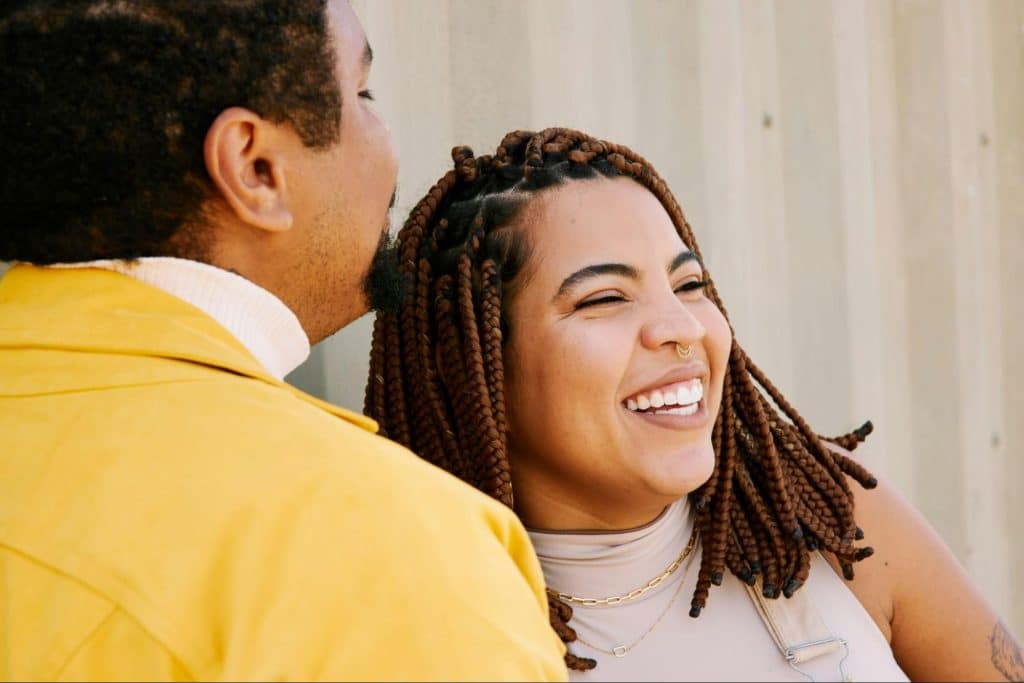 A man saying a funny joke to a woman