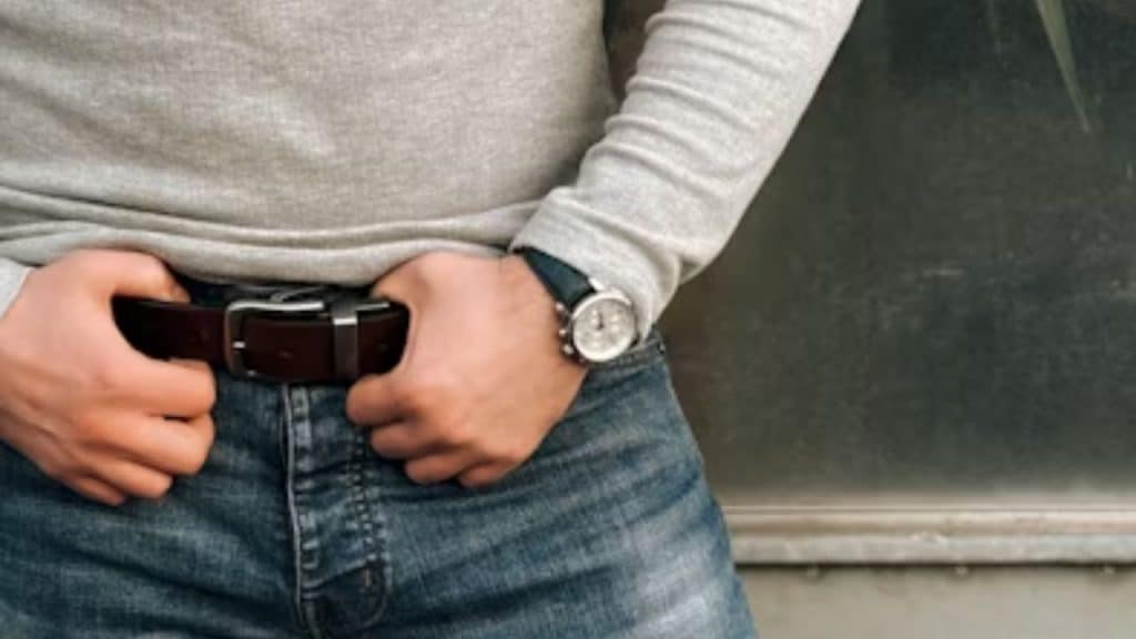 Raw edged brown leather belt paired with rugged jeans