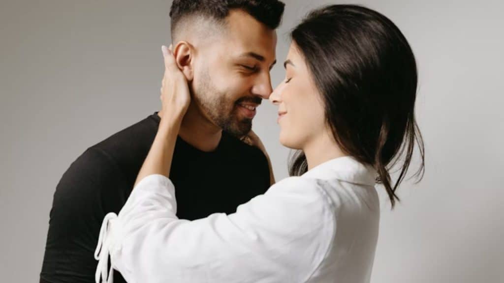 Man hugging his partner,  having a meaningful moment with loved ones