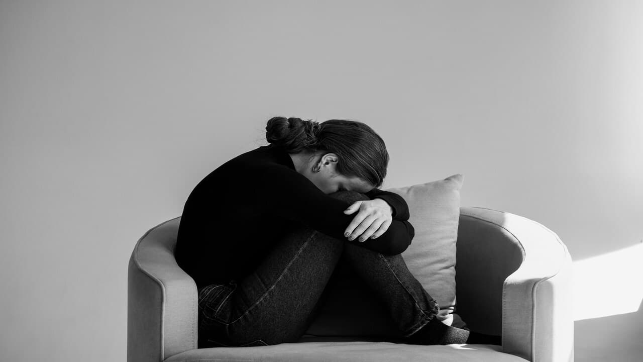 A person alone and sad.