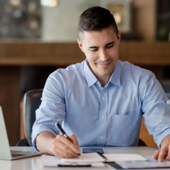 Thoughtful man reflecting alone writing his relationship expectations