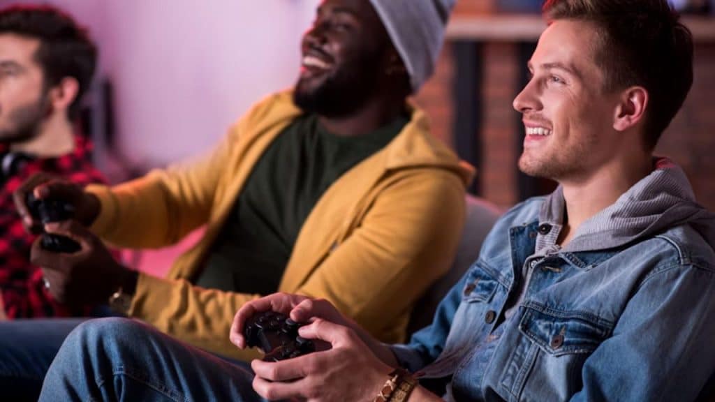 Adult male gamers connecting and having fun together