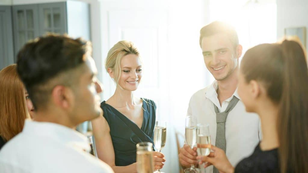 A group of people toasting with champagne flutes.