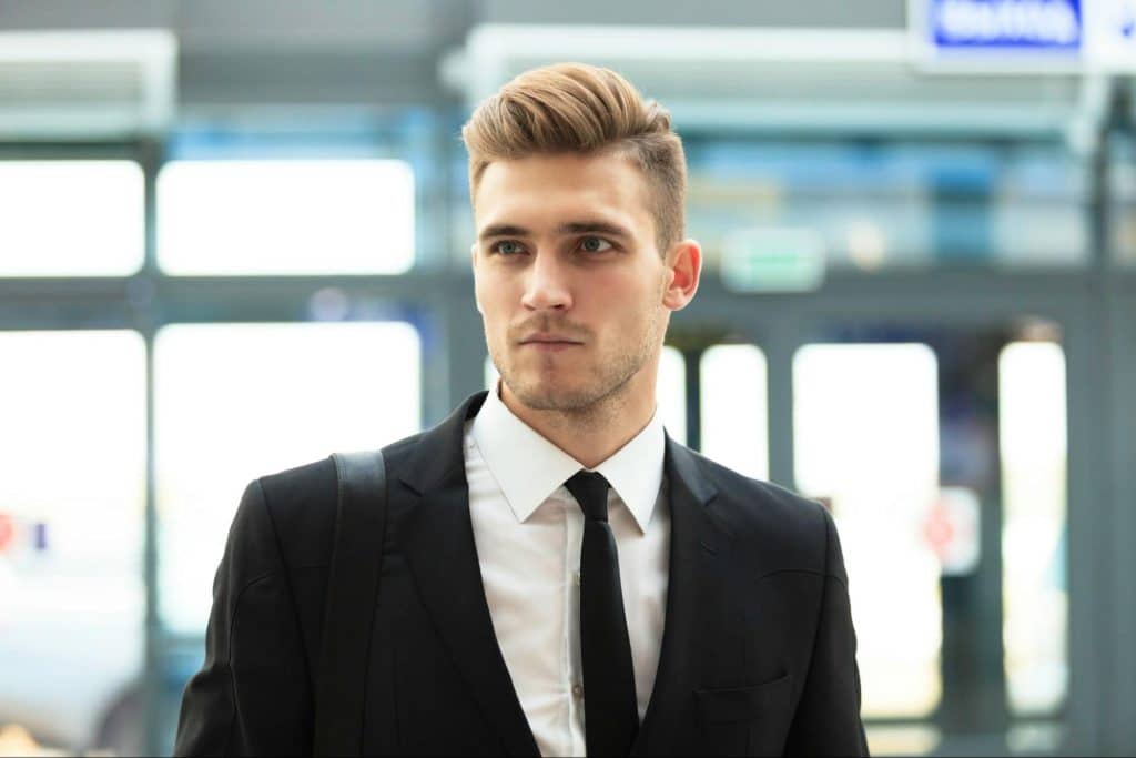 A business man focusing on something.