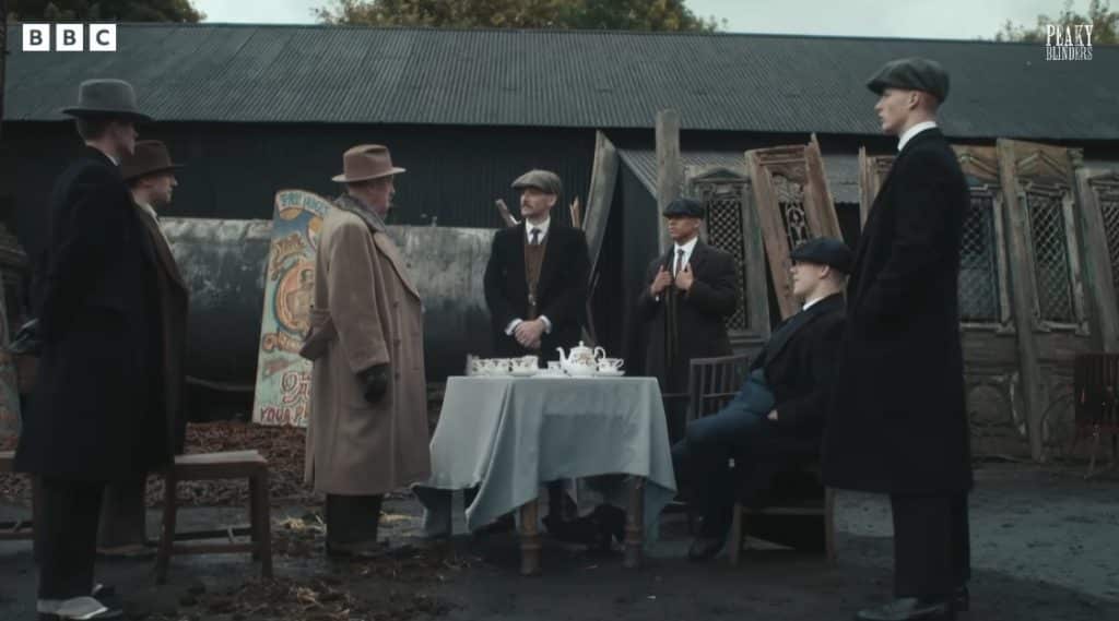 A group of men in peaky blinders.