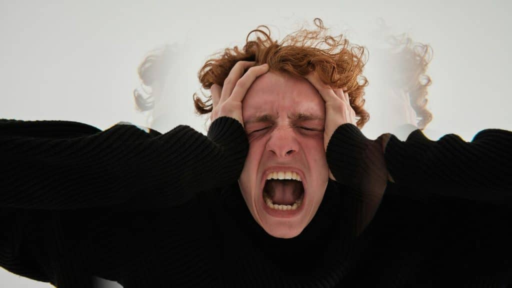 A close-up of a frustrated man