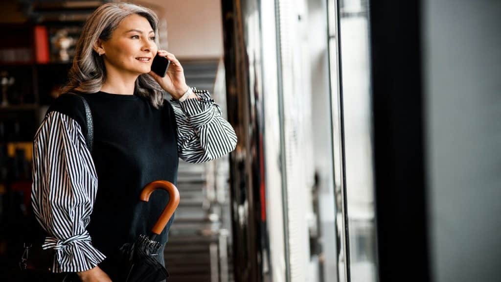 An executive on the phone while looking out the window