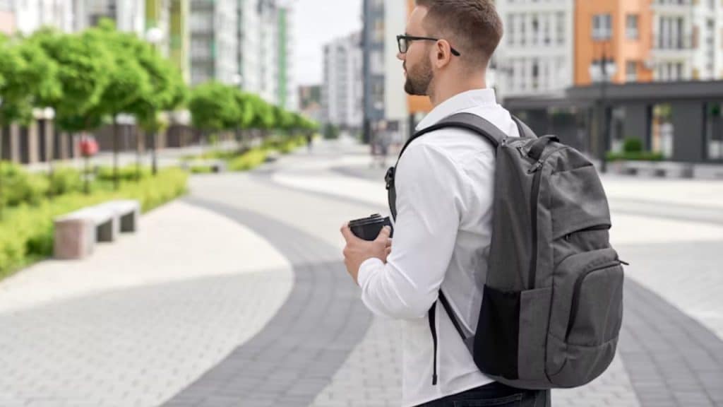 A man confidently walking alone through an urban street