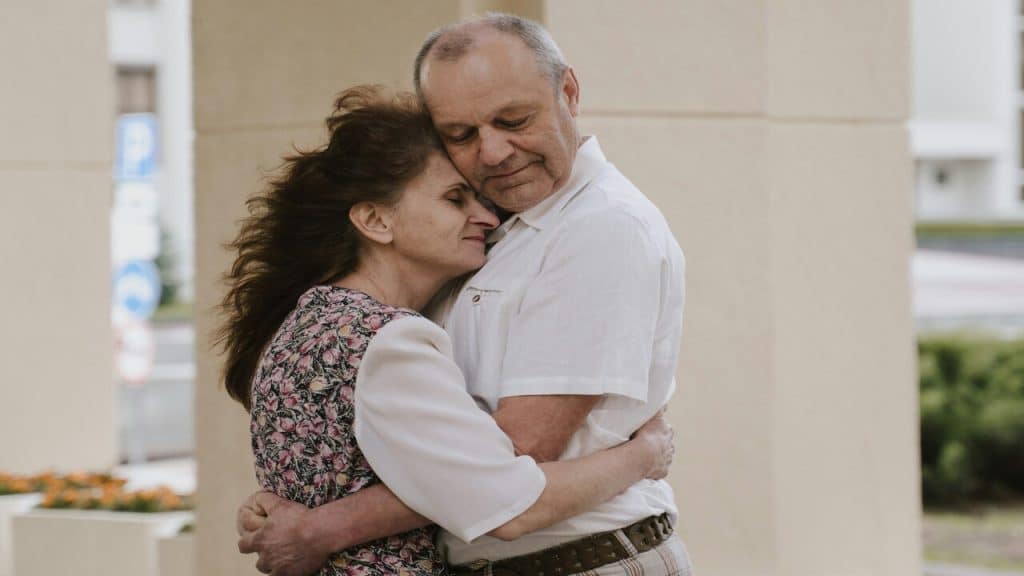 A more mature couple embracing each other