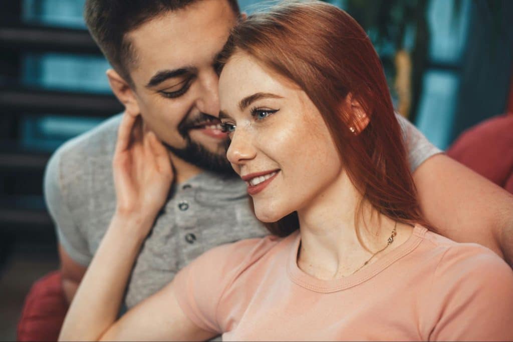 A man embracing a woman 