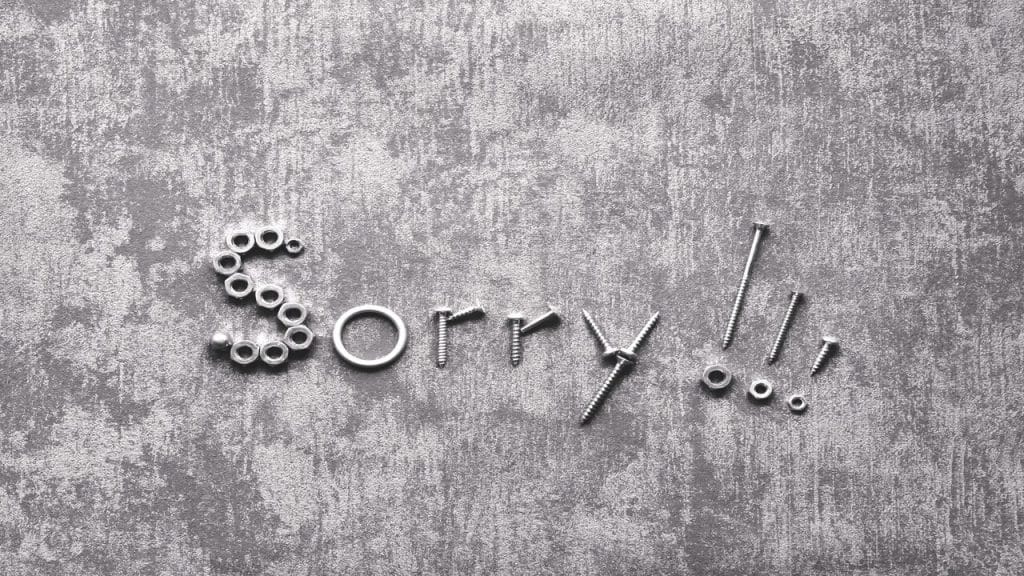 The word “sorry” spelled out using tools