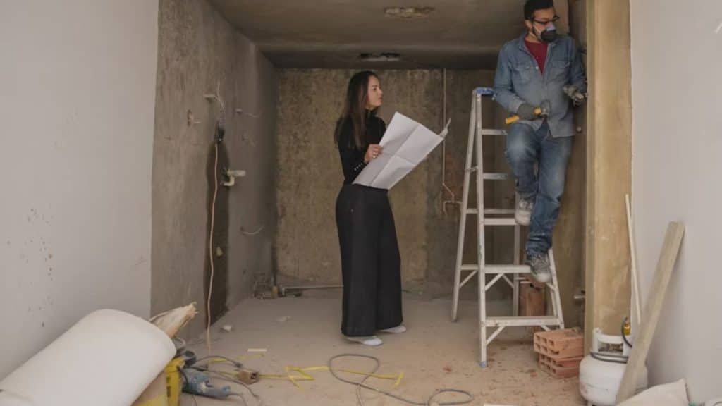 Couple working on a DIY project at home.
