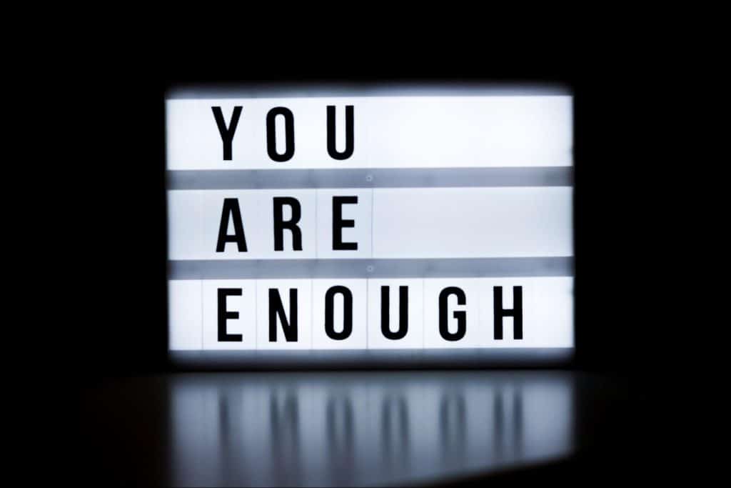 A picture of a sign saying “you are enough”