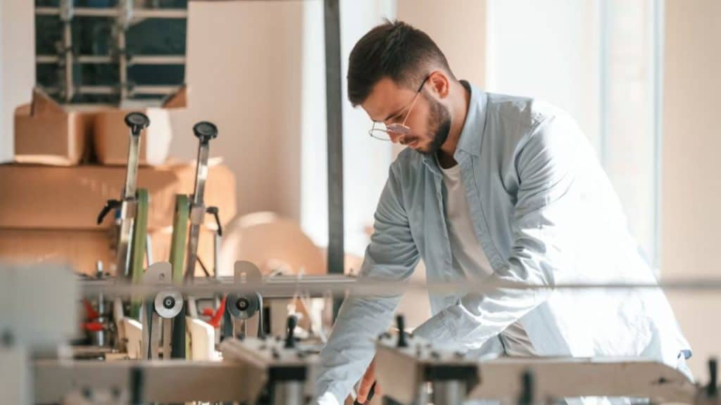 Man nostalgically comparing old items to modern replacements