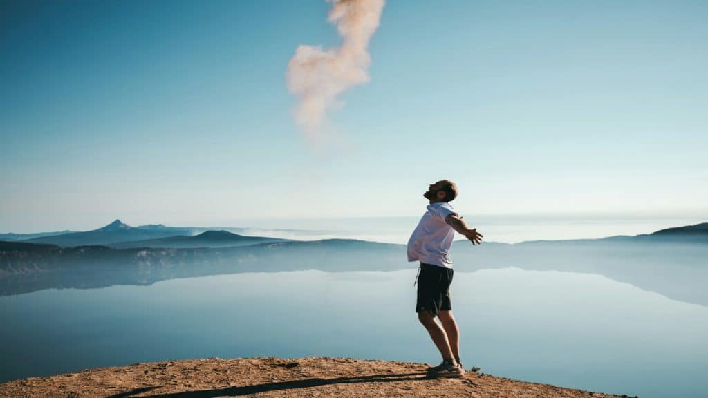 A man by a body of water.