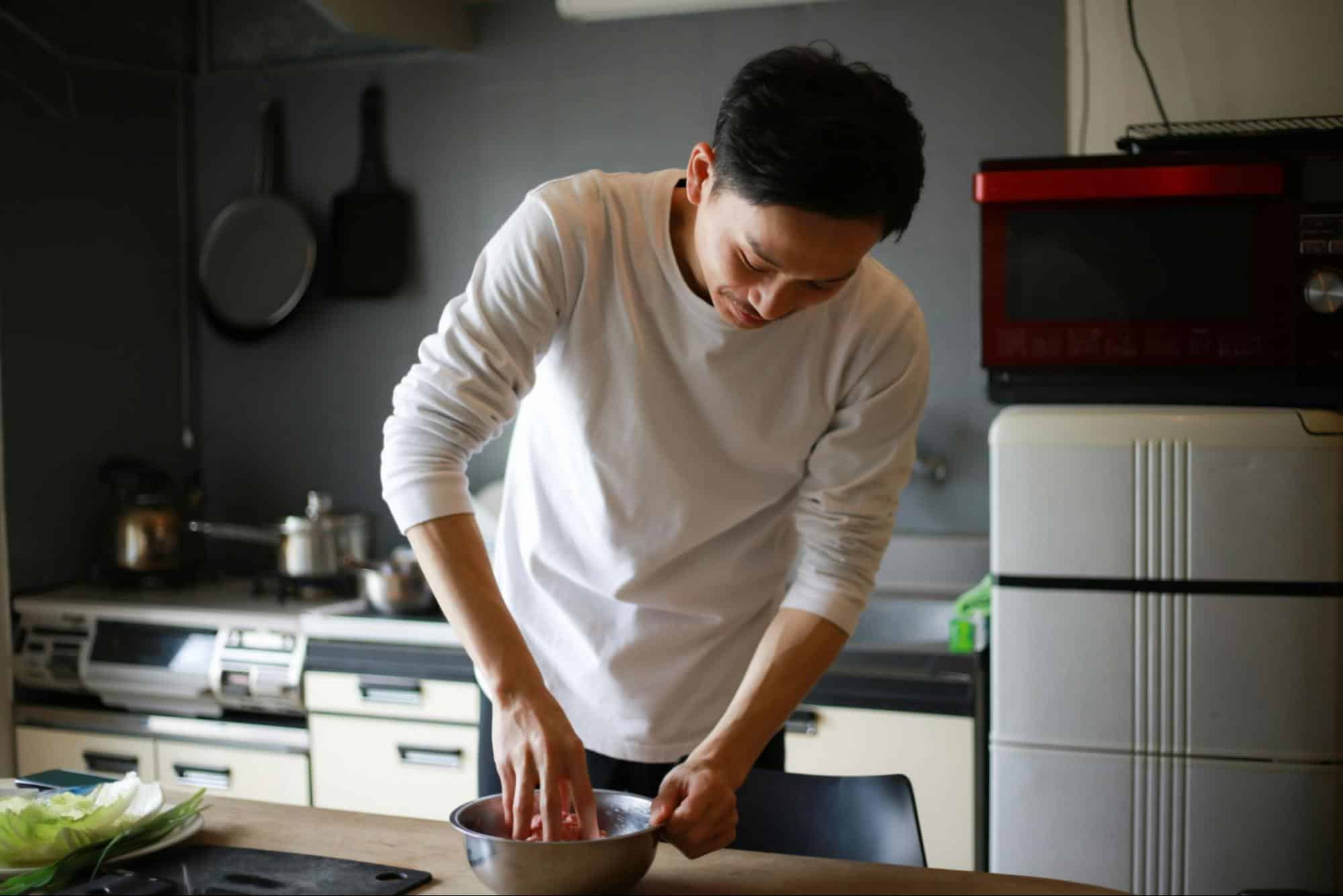 A picture of a man preparing his food.