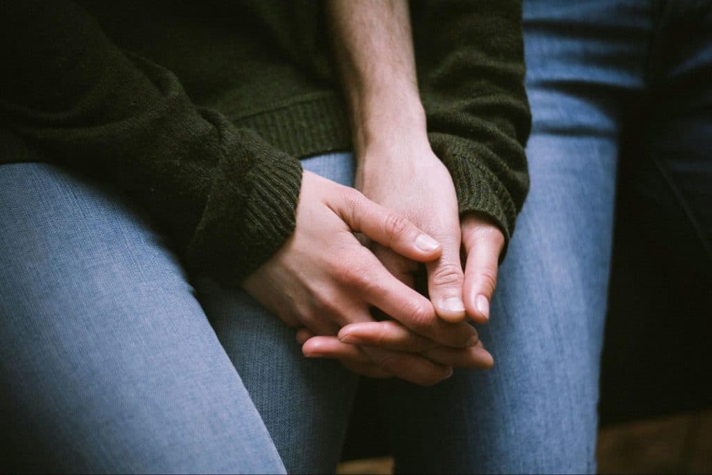 A man and woman holding hands