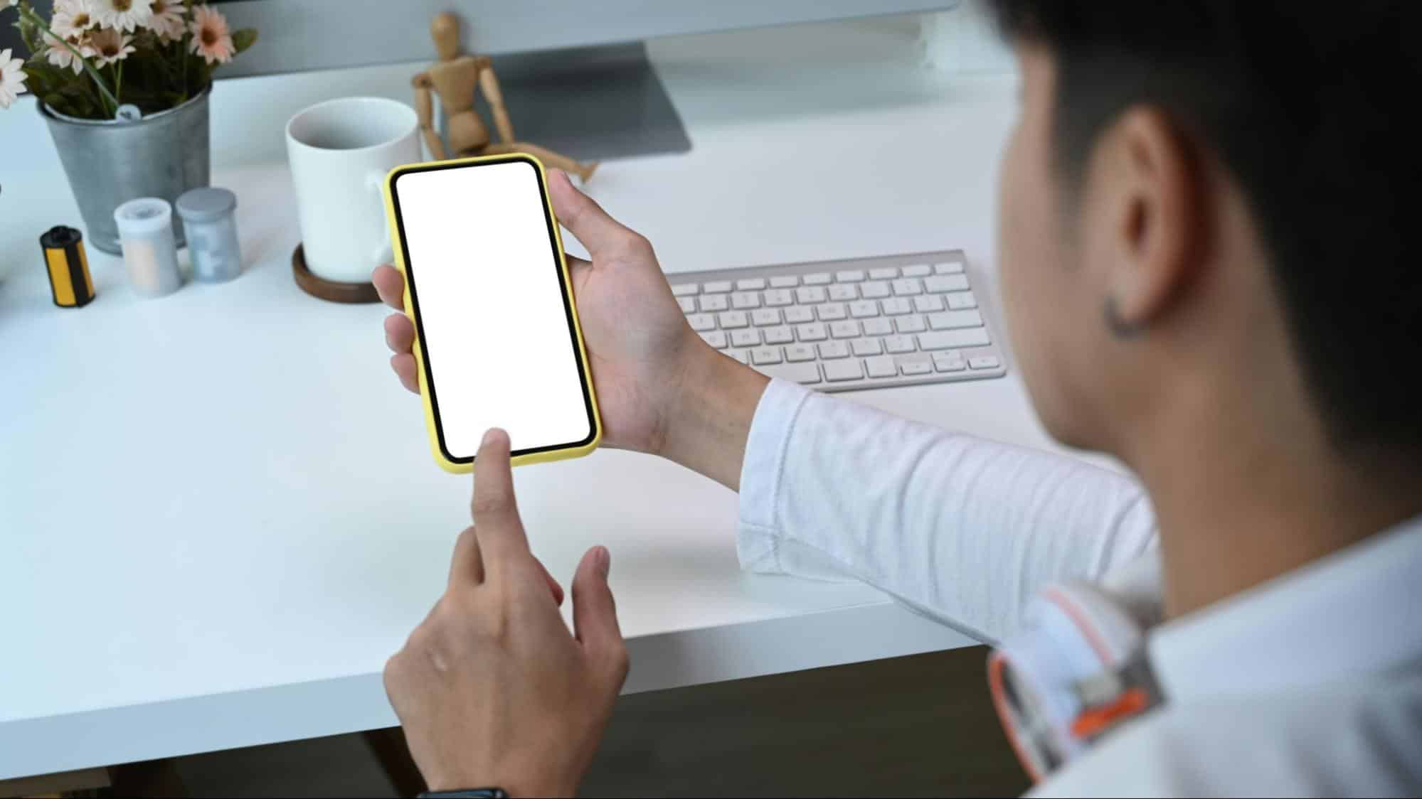A man holding his phone.