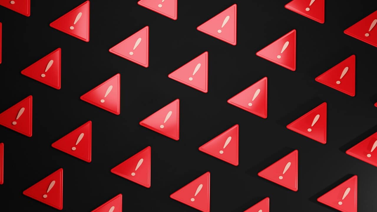 Exclamation points in red triangles.