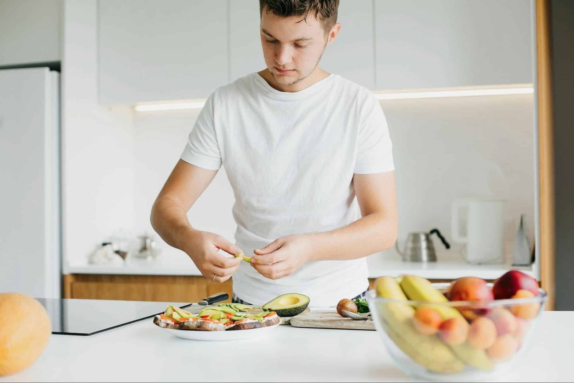 A man preparing a healthy meal.