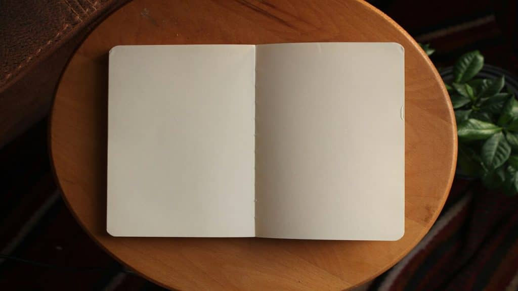 A notebook on a brown table
