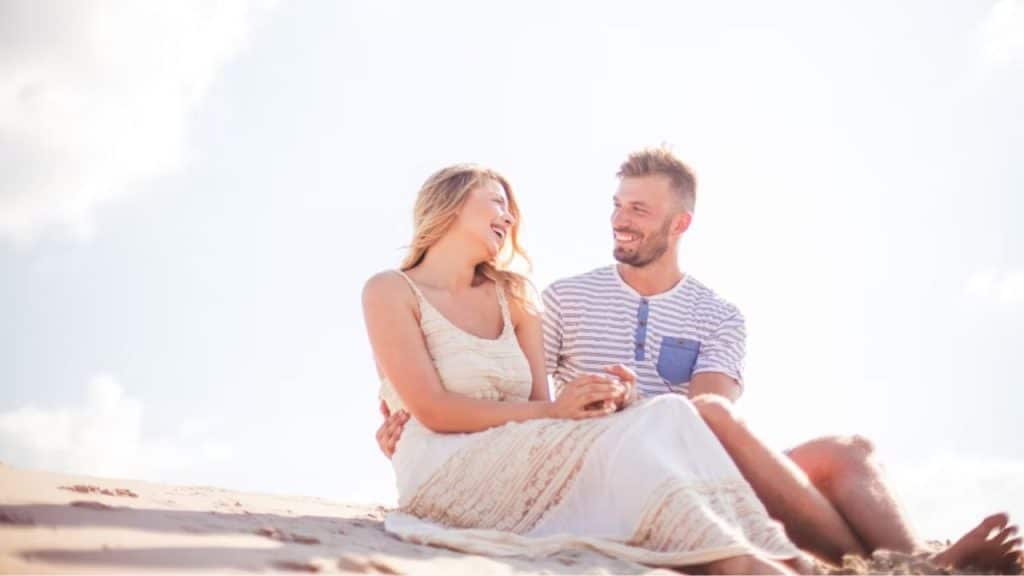 A man and woman enjoying a light, mutual connection during a casual outing
