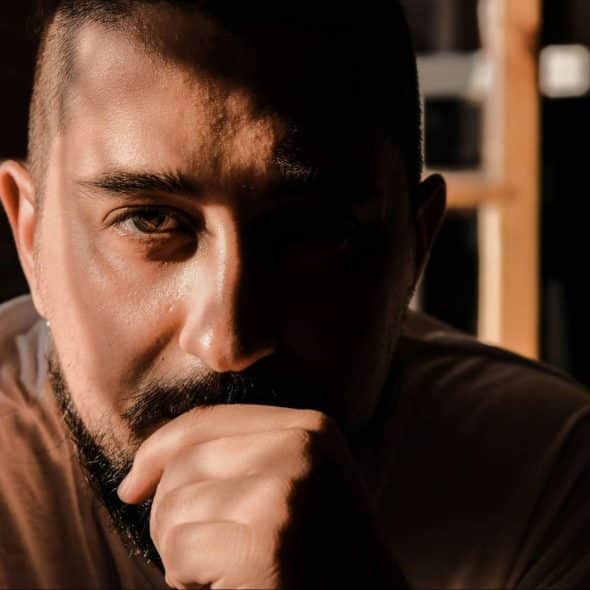 A middle aged man looking serious.
