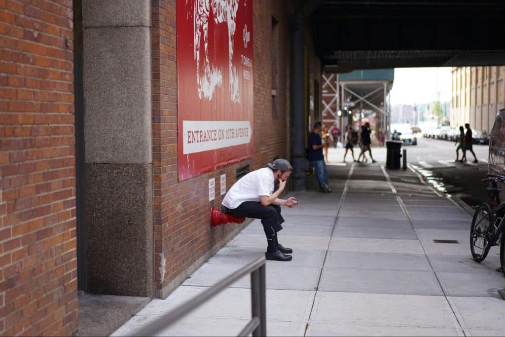 A man texting a woman
