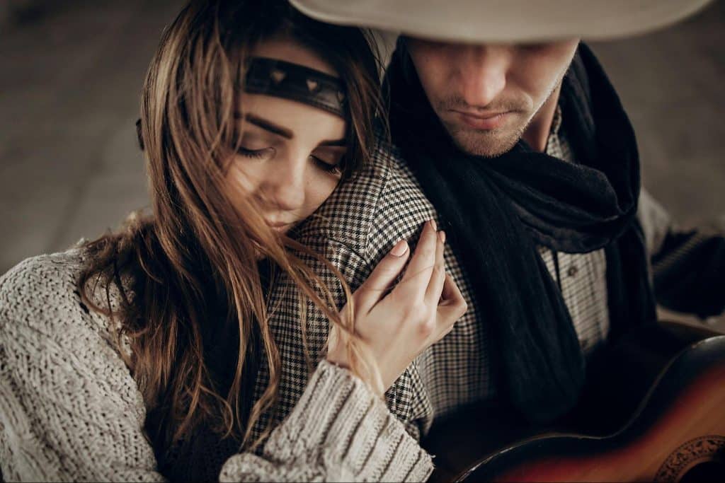 A woman leaning to a man