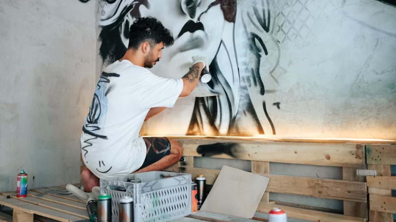 Man converting emotional pain by focusing on a creative project..