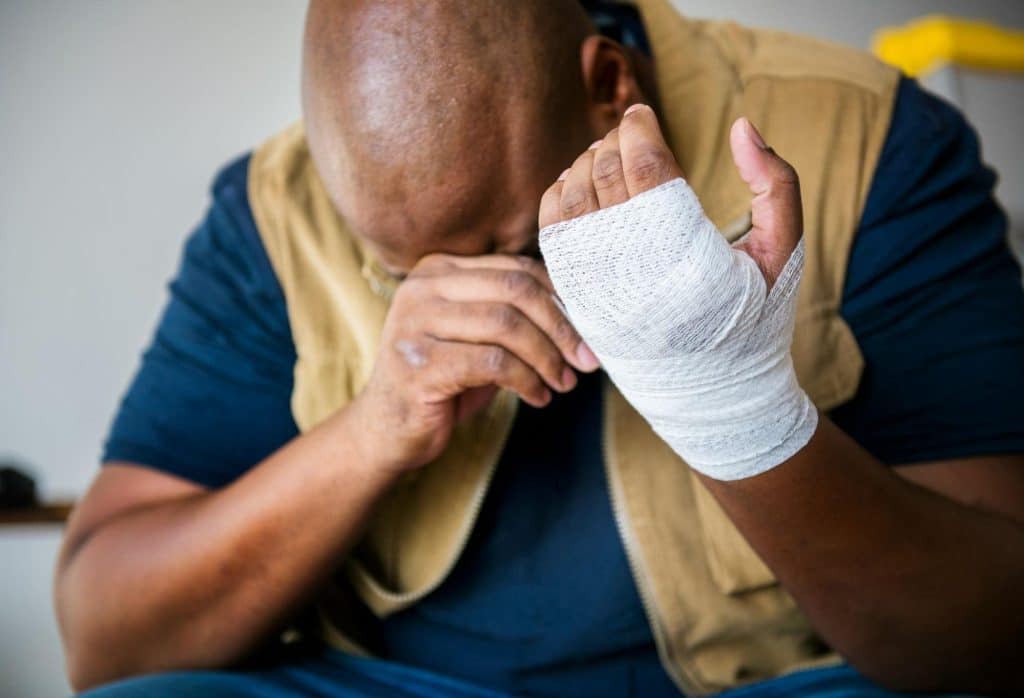 A man with an injured hand
