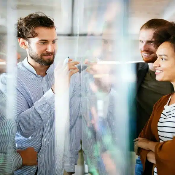 Colleagues having a meeting while smiling