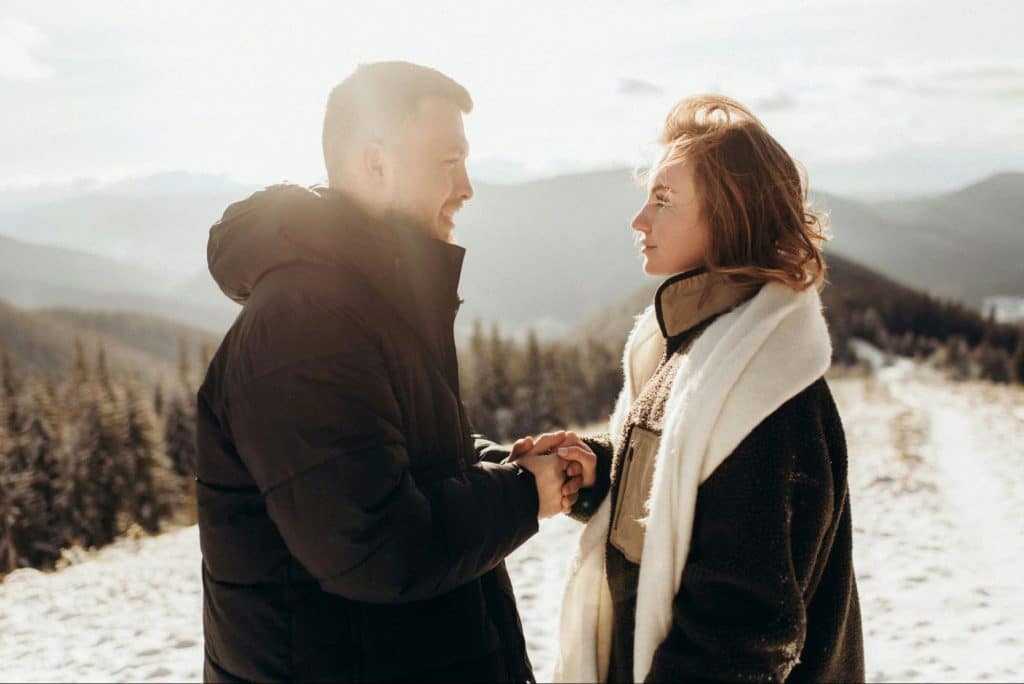 A man and women holding hands
